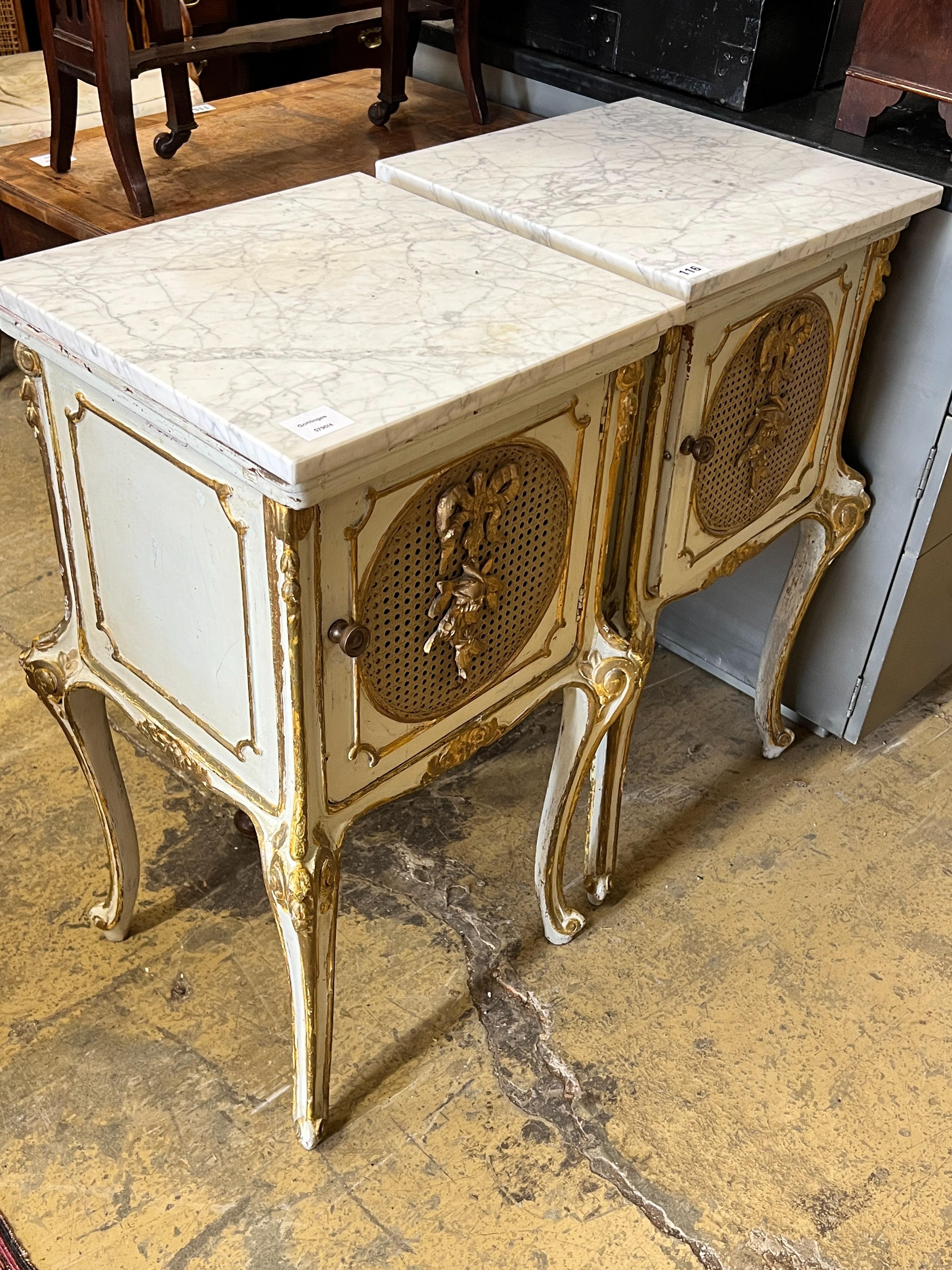 A pair of French caned parcel gilt marbled topped bedside cabinets, width 44cm, depth 41cm, height 78cm